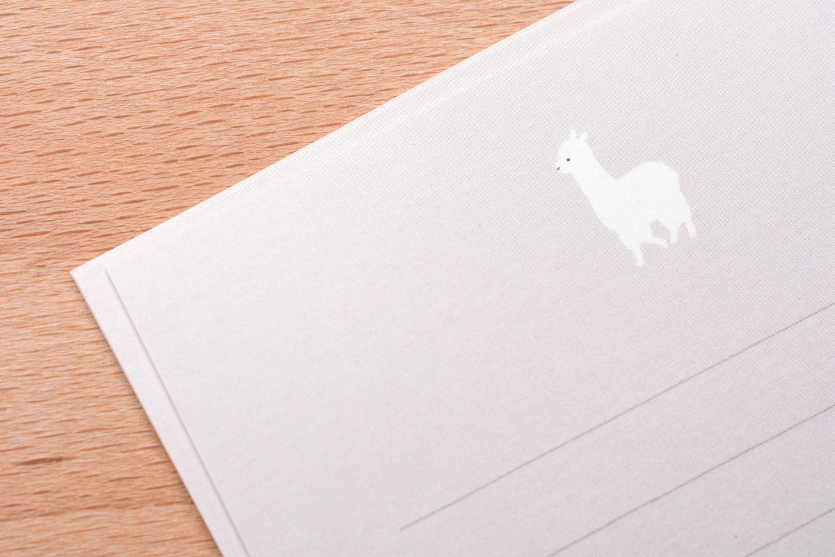 Writing paper and stationery arranged on a desk